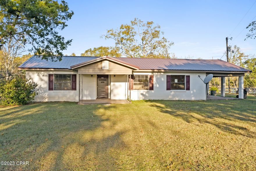 Welcome to your dream country home in beautiful Graceville, Florida! This charming 3-bedroom, 2-bathroom residence is nestled on approximately 1.5 acres of pristine land, providing you with a peaceful and spacious retreat from the hustle and bustle of city life. This home boasts three comfortable bedrooms, offering plenty of space for your family or guests. With two well-appointed bathrooms, your convenience and privacy are ensured. Enjoy the tranquility of country living with this property's idyllic location, set on a paved road, granting you easy access to the amenities of Graceville while still relishing the quiet countryside. The heart of the home features a spacious living area, perfect for entertaining or simply unwinding after a long day. You'll have ample room to create your ideal living space and make cherished memories with loved ones. With approximately 1.5 acres of land, you have plenty of room to pursue gardening, outdoor activities, or even expand your property as you see fit. This property offers the perfect balance of peaceful country living and modern convenience.  Don't miss this opportunity to own your own slice of paradise in Graceville. Schedule a viewing today and see how this 3-bedroom, 2-bathroom home can become your ideal country retreat. Make your dreams of peaceful living a reality in this wonderful home!