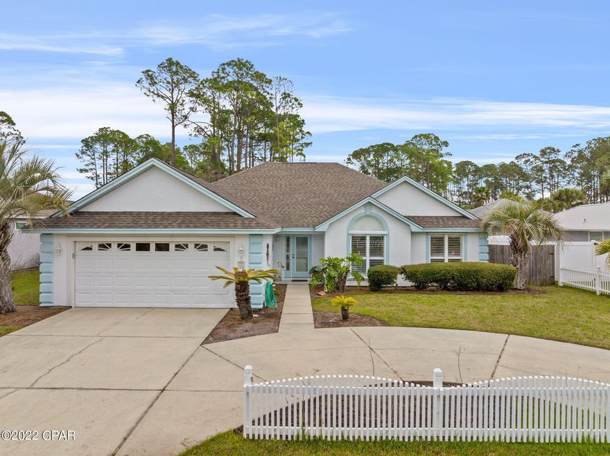 Location, Location, Location!!! If you love the west end of Panama City Beach you're in luck! This stunning 3 bed, 2 bath home offers one floor living and is located in a gated community. This home welcome you with an inviting foyer and has an open living area. The kitchen boast beautiful bullnose granite countertops, black stainless steel appliances, including a double door refrigerator with a double drawer freezer. The windows are equipped with Hunter Douglas plantation shutters throughout the home. The large master suite has a sitting area with a walk in closet off the master bath. This home is located within a short distance from the gorgeous white sandy beach of the emerald coast, about 500 steps.  It's convenient to shopping at 30A and Pier Park! This home is a must see!