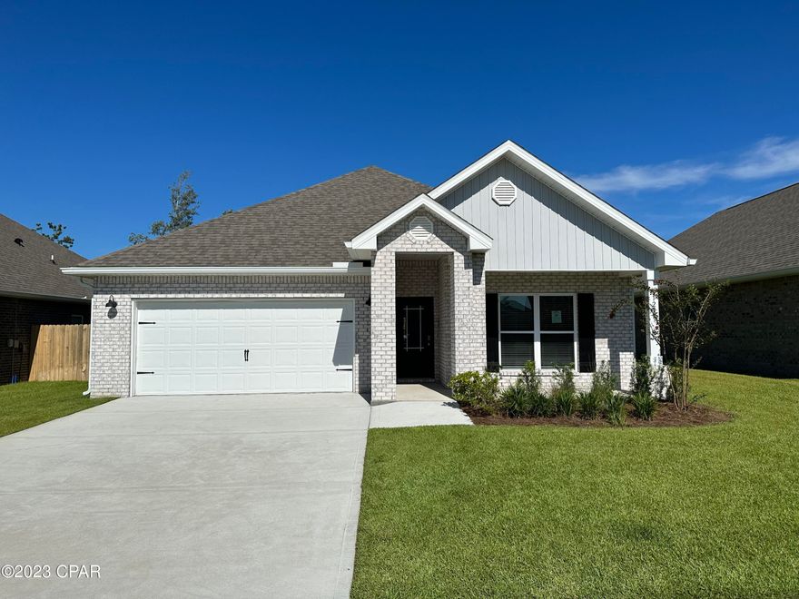 Andrews Park is centrally located off 389 in the very desirable area off Lynn Haven. Our Rhett floorplan is all brick, 4-bedroom 2-bath, it is an open concept floor plan, with a boasting 1,835 sq.ft.  The Rhett floorplan has upgraded finishes throughout. You will find 9-foot ceilings with 10-foot trays and beautiful crown molding. The Rhett also has LVP flooring, granite countertops, a large kitchen island with cabinetry on both sides underneath and brushed nickel hardware.  This floorplan has energy efficient windows to allow lots of beautiful natural light.  The primary bathroom has a beautiful garden tub, perfect for relaxing, and a spacious walk in shower with a glass enclosure. All of these homes come with Deako lighting and Safe Haven smart home systems. Andrews Park homes feature irrigation systems with reclaimed water to help minimize your water expenses. All homes come with a landscaping and sod package as well as gutters.