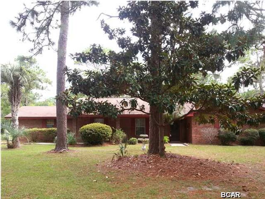 Well built spacious brick home in an excellent location just off 23rd Street Corridor near Frankford Ave. on a 1.5 acre tree shaded lot. Home has been well taken care of and has tile floors throughout living areas and has double payne windows, and deep well replaced 10 yrs ago. Spacious great room with wood burning fireplace, large dining room original kitchen. Florida room has been added a few years ago off the great room and is not counted in the heated and cooled sq. ft. Nicely landscaped yard in a peaceful setting close to everything. Zoning Residential 1 gives possibility to be rezoned for multi-family or business as is adjacent to commercially zoned property. The Feitz Clinic on Frankford Ave being one business on boundary.