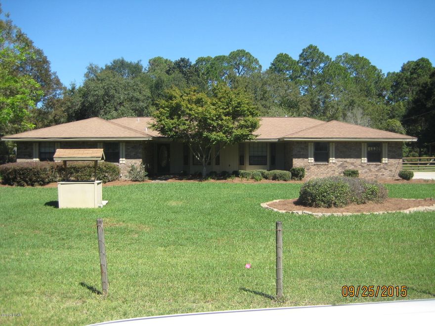LARGE COUNTRY ESTATE 4BR 2.5BA brick home on a 1 acre plus lot. Inside upgrades done recently giving the kitchen a full modern redo w/oak cabinets. Floor plan includes large living dinning combo and large kitchen great room combo with brick fireplace & insert. Living room & Dinning also feature large bay windows with wooden viewing seats. The large corner lot also includes a traditional barn with covered lean to shed for equipment or boats. All fence with a deep well run sprinkler system. The 14x46 oversized covered screened porch gives this home an astounding 3500± SF under roof. This home is perfect for that move up family with kids that need room to roam. Never been for sale original owners!