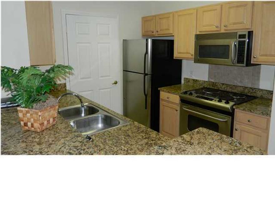 For rent. Fully furnished 4 bedroom, 3 bathroom condo located just a few minutes away from Pier Park in the gated community of Nautilus Cove. Ready for immediate occupancy, the spacious unit offers a split bedroom plan with a large master bedroom and his/hers separate closets. The master bathroom offers a tub/shower combo. The living area is an open concept plan with vaulted ceilings and comfortable seating for five and sleeper sofa. Perfect for entertaining, the kitchen overlooks the dining and living rooms and has stainless appliances. There are two bedrooms with queen beds and a shared bathroom, and a fourth bedroom with private bathroom. Full size washer/dryer included. Rent includes water, sewer, garbage. **No Pets** 6+ month, 1 year lease available.