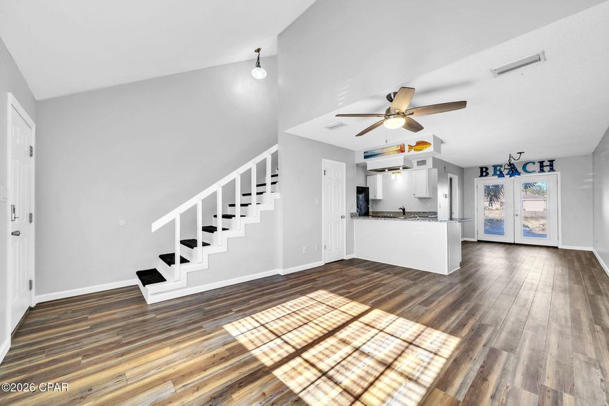 RARE OPPORTUNITY! ONLY 450 STEPS FROM THE BEACH with NO HOA. SHORT TERM RENTALS ARE ALLOWED! ALL FOR UNDER $300K!! This is your opportunity to have an affordable home or investment across the street from the world's most beautiful beaches!! This adorable townhome has two bedrooms, one and one half baths, 4 year old roof, new granite countertops in the kitchen, no carpet, cute back yard area, fresh paint throughout. The only thing missing is you! This is a must see that will not last long! Call your favorite realtor to schedule a showing! All information is approximate and should be verified by buyer if important.