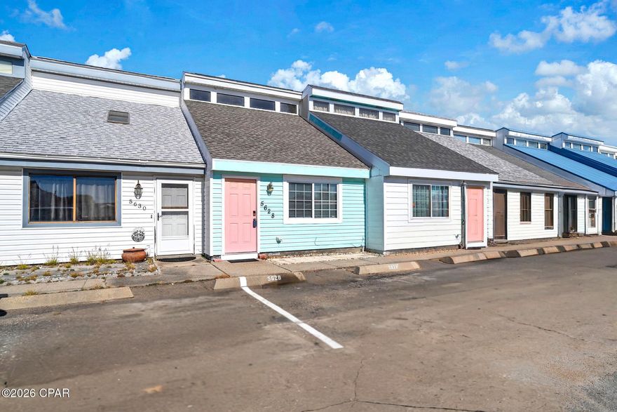 RARE OPPORTUNITY! ONLY 450 STEPS FROM THE BEACH with NO HOA. SHORT TERM RENTALS ARE ALLOWED! ALL FOR UNDER $300K!! This is your opportunity to have an affordable home or investment across the street from the world's most beautiful beaches!! This adorable townhome has two bedrooms, one and one half baths, 4 year old roof, new granite countertops in the kitchen, no carpet, cute back yard area, fresh paint throughout. The only thing missing is you! This is a must see that will not last long! Call your favorite realtor to schedule a showing! All information is approximate and should be verified by buyer if important.