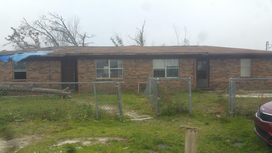 This duplex appears to have taken most damage to the left side. The right side appears ok. It is dirty, but no visible signs of damage.  You will need a contractor to determine that.