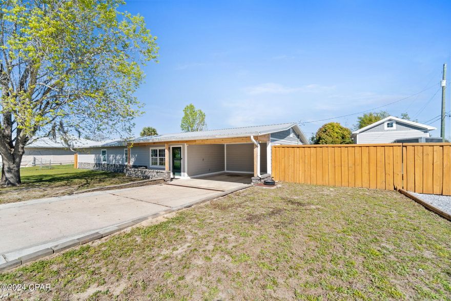 Discover the perfect blend of comfort and elegance in this extensively remodeled home, where every detail has been carefully considered to enhance your living experience. The residence has been expanded, adding more than 300 square feet of space, allowing for additional comfort and versatility. Energy efficiency is at the forefront with a modern tankless water heater and an AC unit installed in 2019, ensuring your home is comfortable year-round while keeping utility costs in check. This wonderful home is located less than 10 minutes away from the entrance to Tyndall AFB!


The home's infrastructure is robust, featuring a new roof installed in 2019 that promises durability and peace of mind. Inside, the charm is evident with high ceilings adorned with beautiful Pine Wood, creating a warm and inviting atmosphere. The kitchen is a chef's dream, equipped with sleek Quartz countertops, perfect for preparing meals and entertaining guests.


The master bedroom is a true sanctuary, featuring a luxurious shower with multiple heads, elegant marble countertops with a double vanity, and a spacious walk-in closet. The home also boasts a versatile Florida room, currently set up as a theater, providing a unique space for relaxation and entertainment. Additionally, the indoor BBQ pit offers a distinctive feature for culinary enthusiasts, complete with proper ventilation for year-round grilling.


Outdoor living is just as impressive, with a well-maintained above-ground saltwater pool, complemented by a newly built deck and a recently installed pump. The property also includes a detached garage/workshop with ample storage and potential for future customization with its existing sub-panel.


This home is more than just a place to live; it's a lifestyle choice, offering a blend of comfort, and practicality that caters to a variety of preferences and needs. Whether you're enjoying the privacy of your deluxe master suite, hosting a movie night in the Florida room, or taking a dip in the pool, this home is designed to accommodate and enhance every aspect of your daily life.


Contact your favorite Realtor today for a private showing!