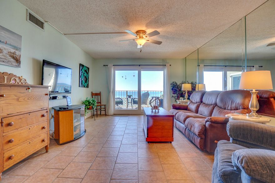 BEAUTIFUL WATERFRONT CONDO at Regency Towers - quiet east end - Master opens to balcony and Gulf.  Gorgeous Gulf views from LR, Dining, Kitchen and Master.  Spacious 2 bedroom with 2 full baths.  Open floorplan with plenty of room to entertain.  Beautiful granite breakfast bar.  Kitchen window adds to the great natural light in condo.  Tile & hardwood floors.  Lots of storage in Kitchen and throughout.  Plus - park outside your building, NOT across the street.  Regency Towers boasts heated pool, Tiki Bar, hot tub, exercise room, BBQ grills and much more.  24 hr staffed Security and Gated Community.  You will love it here!  (some furniture negotiable with offer)