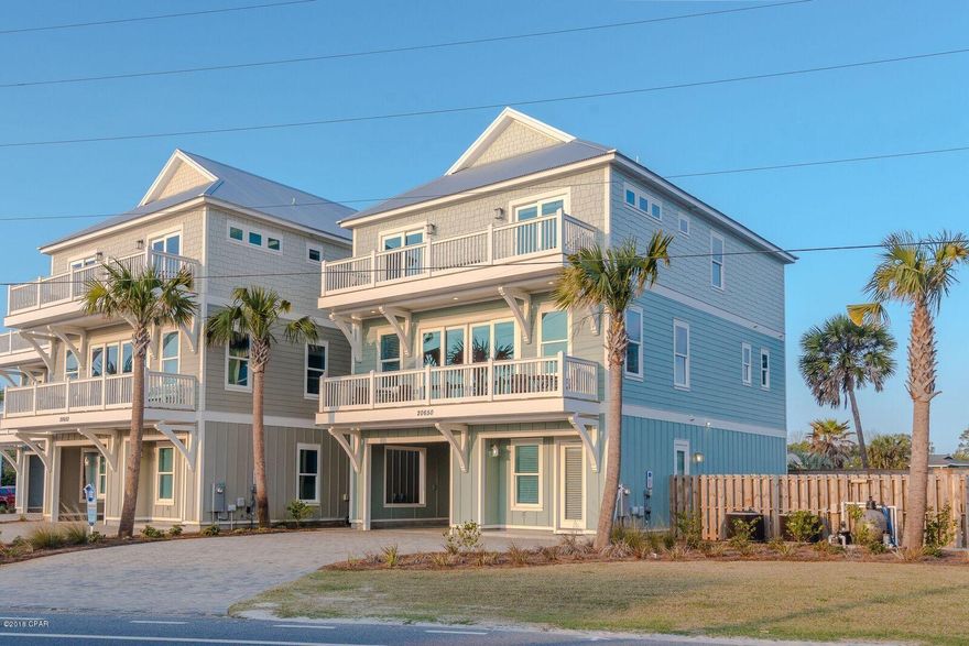 Just reduced by 100,000.00 Owner/developer said it is time to move it.  New beach house with great gulf views.  dedicated beach and beach access right across the street.  Rental machine that sleeps 20 comes completely furnished and on rental program with Holiday Beach Rentals.  Unit has private pool, outdoor kitchen and plenty of decks and outdoor entertainment area.  Coastal Charm is the designer. Great established rental income that is approved by several banks for commercial financing and or residential financing.