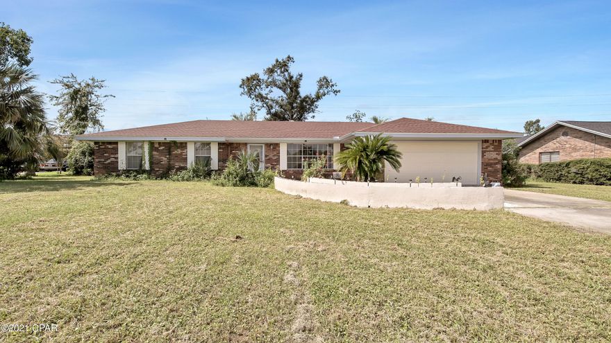 This all brick home sits on over three-quarters of an acre in the center of Northshore. Many updates have been made in the home such as granite counter tops in the kitchen and spare bathroom, a new well in 2020, new flooring (except bedrooms) in 2018, and a new roof and garage door in 2018. The ranch style home features a flex space in the front that can be used as another sitting room or office space. The living room and dining room are spacious with a nice wood burning fireplace. The kitchen has lots of counter and cabinet space with a door leading into the 2-car garage. The back porch is screened in.