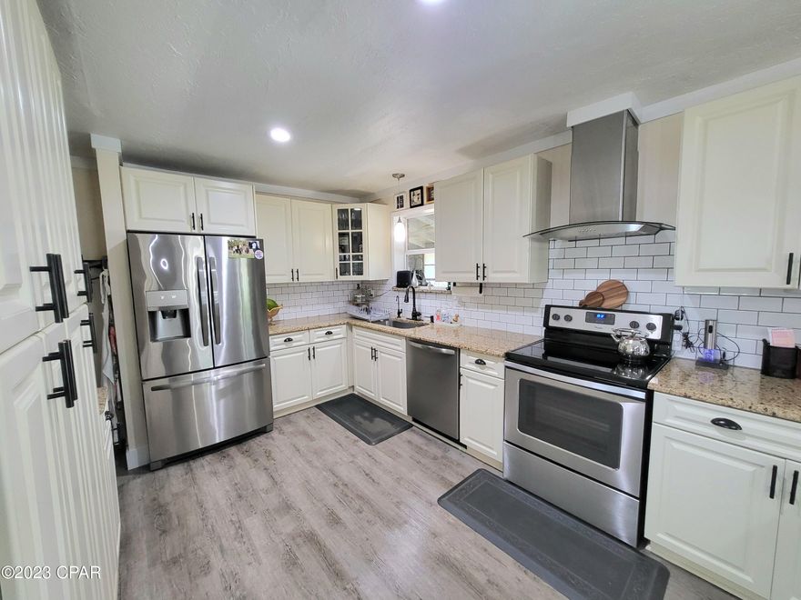 Beautifully remodeled home in Bonifay that is move in ready!  This one has a new roof, new windows, updated flooring and a gorgeous new kitchen.  The color scheme is lovely and it looks like brand new.  There is an extra large screened in laundry room with space for the extra fridge.   It has a nice big yard with a his/hers divided shed.  One side is ''her'' storage and the other is ''his'' workshop! 

 Sit on the back porch enjoying coffee and the peacefulness.