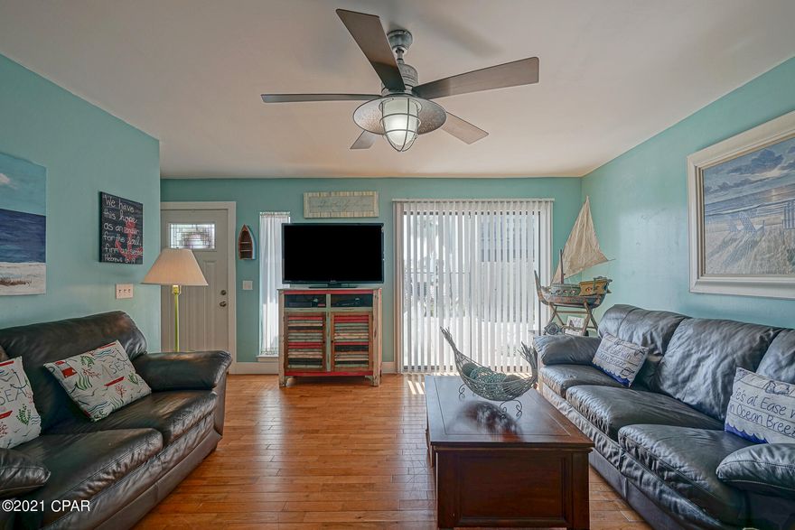 Brilliant Townhome in Panama City Beach! Nestled in a pet-friendly community of nine-units and located one-block from the beach, this 2BR/2.5BA, 1,330sqft property joyfully welcomes with a vibrant coastal exterior color scheme. Explore the openly flowing interior to find gorgeous hardwood flooring, tons of natural light, an expansive living room, and a fully equipped kitchen featuring stainless-steel appliances, white cabinetry, granite countertops, and an adjoining dining room. Both bedrooms each include a dedicated closet, and a balcony where you can even see the gulf from! Short-Term Rent Allowed! Potential annual gross rental income $60k+. Other features: available parking, newer metal roof, low HOA fees only $234 per month cover cable, trash, water, pool, groundskeeping, liability insurance of common areas. Perfect as a primary residence, vacay home or as an investment property! Most of the units are owner occupied, fee simple with ownership of the land. In close proximity to Saint Andrew's park, shopping, dining and entertainment. Just a few blocks to the boat ramp

Age, Square Footage, and room sizes approximate, if important please verify.