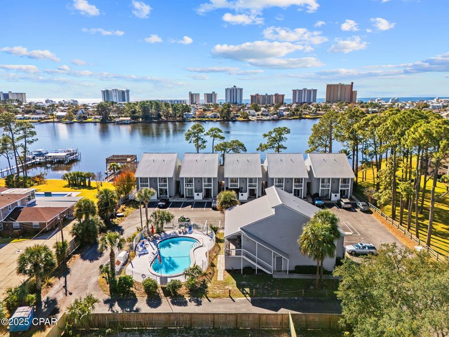 Bright ground-floor 1BR/1BA in the gated, waterfront community of Dockside North on Grand Lagoon. Community boat dock and slips!! 
This unit offers direct access to the pool from a spacious private patio and includes designated parking right in front. The kitchen is ready for a new owner's vision--quartz countertops are already onsite, cabinets can be selected, and it's an ideal opportunity to update flooring prior to installation. Seller is offering a $2,000 credit to complete the kitchen update. (Ask to see layout and photos).

Dockside North is a small, sought-after community with first-come boat slip access, a waterfront pavilion, and easy Gulf access. Located on the quiet east end of Panama City Beach. Priced to sell and perfect as a primary residence, second home, or investment.