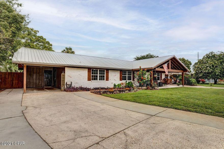 UNDER CONTRACT, SELLER ACCEPTING BACKUP OFFERS: Motived Sellers! - Enjoy convenience in traveling to the city, or the beach in this solar powered 3 bed, 2 bath tastefully updated home with plush landscaping, and ample parking. Solar panels were paid in full (~30k), so there's no monthly payment to be picked up, but enjoy reduced electricity bill in the seller's case to $20-$30 per month. Out front is a large covered porch with beautiful clear views of the sunsets. Out back is a large screened in porch with drop down rain guards, and recessed lighting. Also a shed with a large carport under it, and a palm tree centrally located in the yard. Recently replaced AC with upgraded 4 ton heat pump. And a BRAND NEW water heater Updated bathrooms, and open concept living and dining room. Kitchen has backsplash, and a large island for ample countertop space.  The kitchen, living and dining spaces have Lutron smart lights and Nest thermostat. Contact your Realtor to come see!