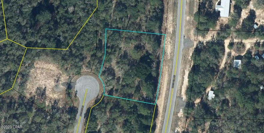 Pretty wooded parcel on cul de sac