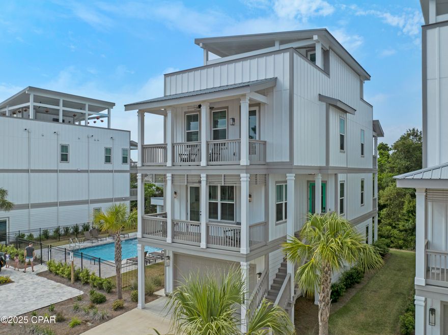 This almost new home comes fully furnished and is in close proximity to the sugar soft sands of the Gulf of America. The home boasts 5 bedrooms with a view of the Gulf from the roof top. The open concept first floor offers a chef's kitchen with dining and living room attached and open. The tall ceilings make the home look even larger that 3000+ SQ FT. The Community Pool is an added feature for your relaxation.