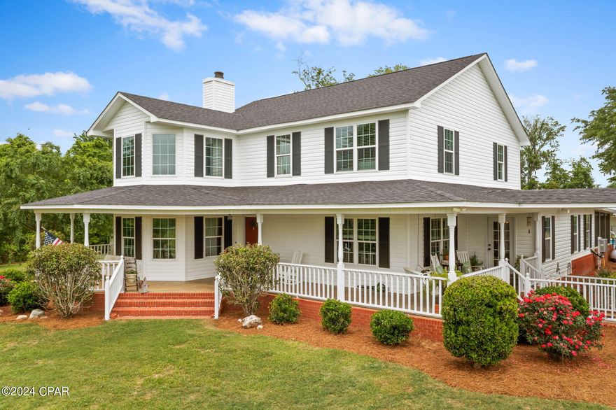 This charming mini farm boasts a 4-bedroom, 2.5-bathroom farmhouse situated on 16.21 acres of land. The home features two bedrooms downstairs and two upstairs, along with a beautiful spacious kitchen with custom cabinets, granite countertops, wood floors, and a kitchen island bar. The spacious living room has a soaring 17-foot high +-ceiling, a cozy fireplace, and a bonus sitting area. There is also a separate dining room for formal meals, or it can be used as a den/office. The front porches offer many areas for swings and rockers for another area to relax and sip your coffee or tea.

The oversized laundry room and mudroom lead to a 14 x 53 screened back porch, perfect for entertaining or relaxing with family. Step outside to enjoy the in-ground pool for summertime fun with a nice gazebo to sit under for shade or have a picnic. Additionally, there is a separate man cave/mother-in-law suite, or pool house with a full bathroom. There is so many possibilities for that space.

The property includes several barns that can be used for animals/storage, an RV/boat shed, fencing, plenty of room for a garden and a large carport next to the house. A pond at the front of the property adds to the picturesque setting. This mini farm offers the perfect blend of comfort, functionality, and outdoor enjoyment.

The home also sits minutes away from Blue Springs Recreation Park. The spring is listed as the First Magnitude Spring of Florida and it supplies water to a 202-acre reservoir known as Merritts's Millpond, a nationally known fishing site.

******* There is a security system in place and a termite bond. The fireplace mantel that's in place now will be removed and another one installed. The 1/2 bath cabinet/sink will be removed and replaced also. *******