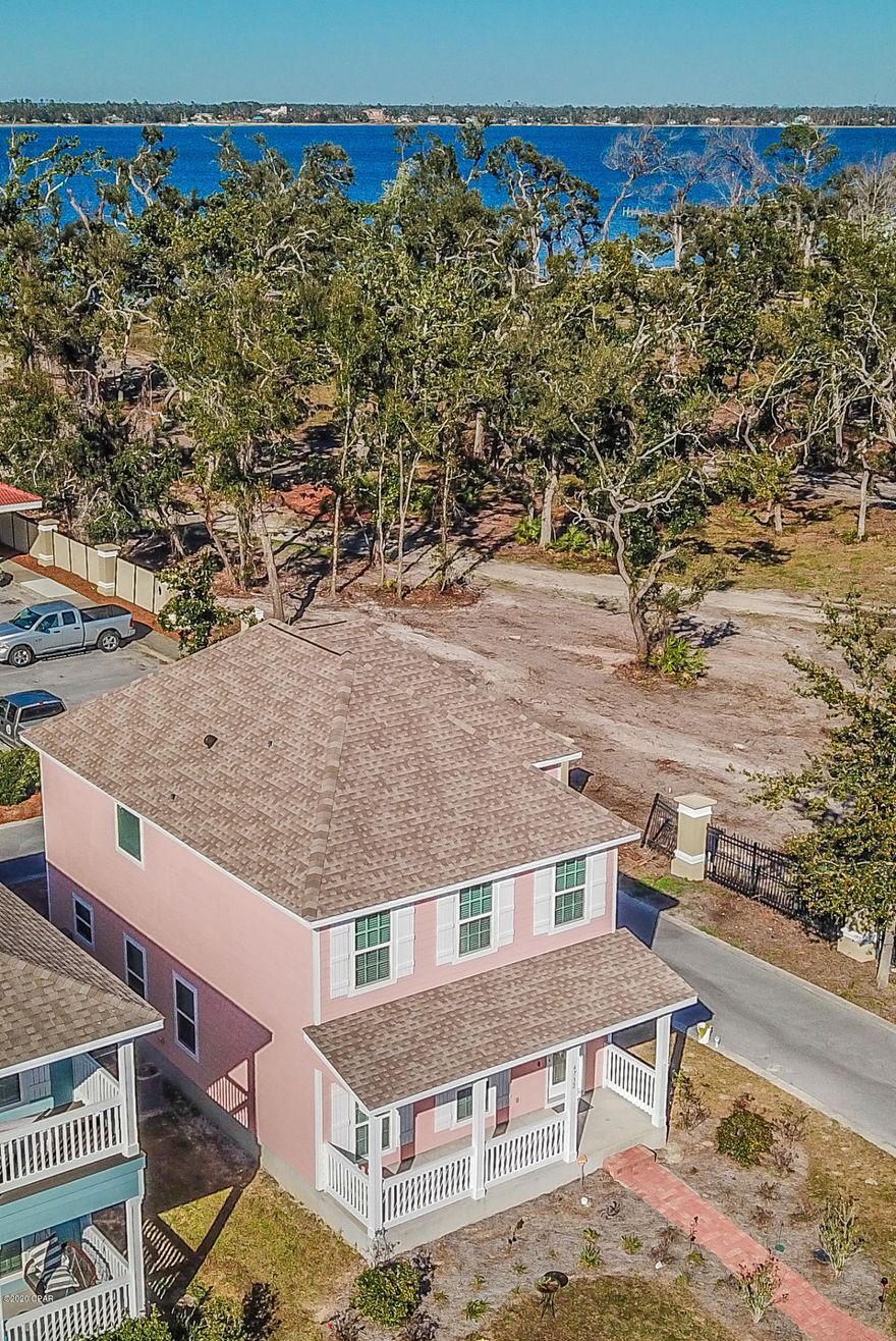 Completely renovated craftsman style home with Bay views in the gated community of Magnolia Bay.   This 3 bedroom 2 1/2 bath is located on a quiet corner lot and within walking distance to the bay and large resort lagoon pool, fitness center and dock.   Downstairs has new laminate flooring and a spacious open floor plan with lots of natural light.  The kitchen has granite counter tops with stainless steel appliances and beautiful cabinetry.  Upstairs you'll find new plush carpeting in all 3 bedrooms.   The huge master suite has a sitting area, beautiful master bath with walk-in shower and large walk-in closet. Magnolia Bay is a private Bay front gated community with sidewalks, an fitness center, a large resort style pool and it'