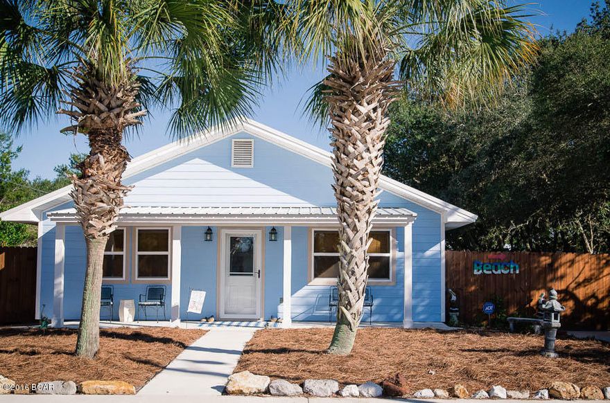 This fabulous Beach Home is truly a MUST SEE. The home sits on one lot and there is an adjacent lot which is included with the listing price. There is a privacy fence surrounding the back yard. This wonderful beach home has recently been painted through out,as well as new windows and Hardie Board siding. All appliances, HVAC, roof, pool pump and hot water heater are less than 3 years old. The cabinets are Martha Stewart soft close . Beautiful 18 x 18 Ceramic tile through out. The back yard of this home is truly a WOW!! The stunning 20 x 40 pool is a great family oasis for entertaining. There is a 19 x 24 screened in porch with a retractable screen, a half bath and summer kitchen for all your outdoor activities. This will make a fun place to watch your favorite sports and movies. Included are two large storage buildings for you  to store all your beach and pool toys, Yolo boards, kayak, golf cart, riding lawn mower and so much more. The home is located on a dead end street, is only 3 blocks to the beach and the neighborhood is Golf Cart friendly. Pier Park and  30a are a very short distance away.  This one of a kind beach home is just waiting for you!