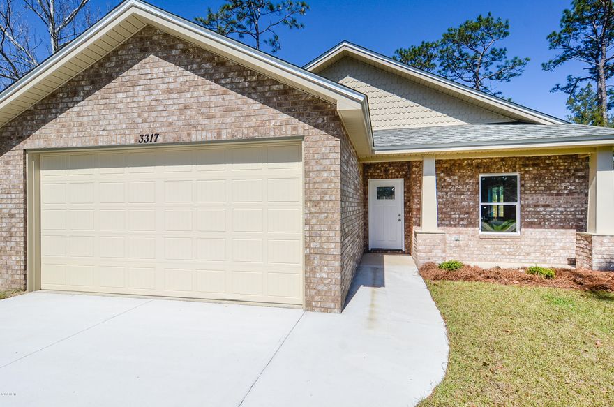 CONSTRUCTION IS NOW COMPLETE!!! This lovely 3 bedroom, 2 bath home is Ready for a buyer!! Nice open floor plan, Family Room open to the Dining Room and Kitchen...great for entertaining! Upgrades throughout the home include crown molding, trey ceilings, solid surface countertops, custom cabinets, stainless steel appliances, wood flooring throughout living area, tile in kitchen, baths and laundry room and carpet in bedrooms only! 2 car garage with pull down stairs and attic storage, large backyard, sprinkler system and much more. Home qualifies for USDA loan, 100% financing!  Home is also close to TAFB, just a short 10 to 15 min drive to Tyndall! Make this your home today!! INCLUDES BUILDERS WARRANTY!!