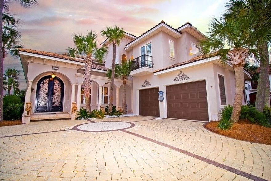 LOCATION LOCATION LOCATION!! Luxury Waterfront Mediterranean style home located in the beautiful Finisterre neighborhood, on the same road as Capt. Andersons Restaurant and only a *1 mile boat ride to Shell Island.*  This friendly community is gated and features tennis courts, playground area, and picnic area. This home is made for a family that loves the water.  Take a stroll down the 100ft. dock with 10,000lb. boat lift, fishing/sunning area, and a jet ski docking station for two jet skis. The exterior of the home offers an oasis feeling with its beautiful pool with dolphin fountains, pergola, fire pit and for the grill master; an outdoor kitchen. The home features 4 bedrooms and 3.5 baths. The kitchen is stunning and functional with its beautiful granite countertops and stainless steel appliances. The great room features a cozy fireplace, built in entertainment center and french doors. The dining area has room enough for a large dining table and has a gorgeous chandelier.  The master suite is located upstairs so you can enjoy the magnificent views of the bay and St. Andrews State Park. Open your french doors and walk out to your private 16x7ft. balcony and take in the breeze. The master bath is fit for a queen and features a customized walk-in closet, double vanities, separate shower with two shower heads and a jacuzzi tub with a beautiful chandelier hanging above for a romantic feel. Located on the second floor is a media/entertainment area with awesome views of the bay.  This home has so much to offer and owner is motivated to sell.  Please call today for your private viewing.