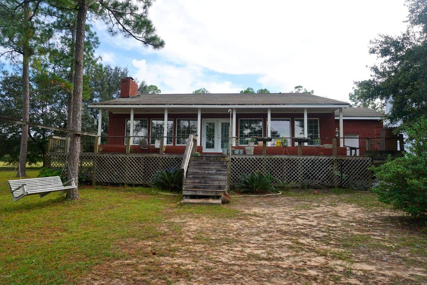 Waterfront home on beautiful, crystal clear, Silver Lake! This 3 bedroom, 2 bathroom home, features a kitchen with custom wood cabinets with breakfast bar, that overlooks a large living area with hardwood floors, a fireplace, and views of Silver Lake. The large windows bring a lot of natural light into the home along with the view. The master bedroom is carpeted and master bathroom is large with a double vanity, jetted tub, and a separate spacious shower. Silver Lake is a spring fed lake with aqua blue clear water and sandy bottom. It is the 2nd most pristine lake in FL (No motor boats allowed) that's 265 acres of spring fed water and approximately 65 ft deep. Enjoy fishing, swimming, Canoeing, kayaking and scuba diving!