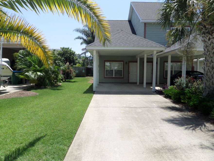 You can enjoy a clean freshly painted home.This duplex town home has on first floor a open living, dining & kitchen area great for entertaining. Nice patio area for cooking out just steps out back door.You have a half bath,washer&dryer also on first floor.Pretty hardwood stairs leads to bedroom with a spacious bathroom has a tub/shower. Good closet space. Oh the balcony is a good sitting place to look at the nicely landscaped yard. No you do not have to mow yard service is included in the rent. In front you have 2 covered carport spaces. Just a few blocks to the beach and a couple blocks to lagoon boat ramp.