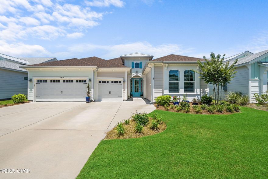 Nestled in phase 3 of the resort-style community of Latitude Margaritaville, 8324 Fins Up Court is a meticulously designed Aruba floorplan featuring coastal-inspired refined finishes, custom upgrades, and a seamless layout. Upon arrival, you're greeted by an expansive driveway, lush greenery, and a vibrant yet tasteful facade. Step inside to a welcoming foyer with tall ceilings and beautiful wire-brushed laminate flooring throughout the main living areas.

The heart of the home unfolds into a sophisticated living space designed for relaxation and entertainment. A gas fireplace, custom soaring vaulted ceilings adorned in shiplap and warm and cozy tones, infuse the space with a coastal ambiance. A covered porch with a custom extended lanai offers a seamless continuation of living space and further connects the home to the preserve, a rare feature in the community. Beyond the lanai, a lush green yard provides ample space for a pool or hosting outdoor gatherings.

The chef's kitchen is equally impressive, featuring white quartz countertops, an oversized island with integrated seating, and a luxury appliance package including a gas range and modern fixtures. A banquet of windows floods the formal dining room with an abundance of natural light and fabulous views of the preserve.

The primary suite is a retreat of its own, boasting custom tray ceilings, a cozy sitting area framed by bay windows and dual walk-in closets. The private ensuite provides a true spa-like experience and is accessorized with double vanities, a custom tiled floor-to-ceiling walk-in wet room with dual showerheads and a built-in corner bench.

The junior suite towards the front of the home provides ample space for guests or family, with its own beautifully appointed full bathroom. A flexible bonus room is perfect for an office, gym, or studio, conveniently located next to the half bath. An oversized laundry room, just off the kitchen, offers both form and functionality with custom-built-ins, an Electrolux front-load washer and dryer, a utility sink and direct access to the three-car garage.

This true, custom-built home in 2023 boasts numerous and premium upgrades, including impact glass at the front entry, an extended lanai, pavers, vaulted beamed ceilings, a three-car garage, upgraded hardware, plantation shutters, countertops, light fixtures, tile, trim, plumbing fixtures, appliances, cabinetry, and much more.

As part of Latitude Margaritaville, residents enjoy an amenity-rich lifestyle just a 5-minute golf cart ride from home. This includes a lagoon-style pool, an amphitheater with live music and events, a state-of-the-art fitness center with on-site trainers, a lap pool, pickleball, tennis, basketball courts, a woodworking shop, a theater, and more. Plans for an on-site Publix and shopping plaza add unmatched convenience, while the sugar-white sands of the Gulf are poised just minutes away. Inquire today and start living the coastal lifestyle you deserve.