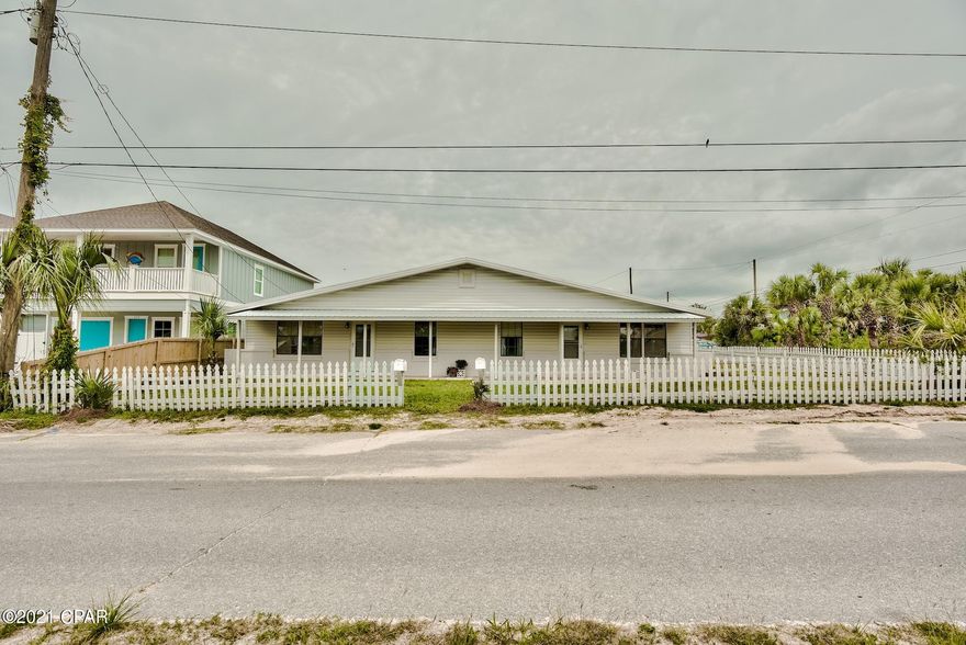 Under Contract, Accepting Backup Offers. Charming One Story Florida Beach Cottage/Duplex within a block to the sugar white sands of Laguna Beach. BRAND NEW METAL ROOF! Wood look tile in both kitchens and all four baths. Choose from one of two convenient Public Beach Accesses. Rent one side, both sides or combine the two sides for one bigger home. Covered carport for two cars each side (for a total of four covered spaces). Large paved area for additional cars or room for a pool.

No HOA! No rental restrictions! Property is not being sold furnished, but furnishings may be purchased separately.