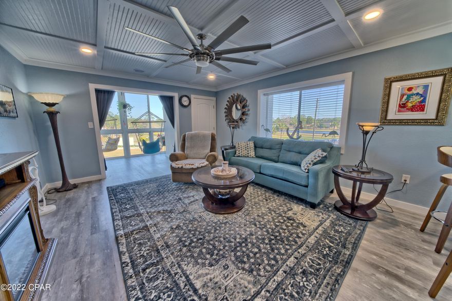 Beautiful remodeled 2BR/2BA condo overlooking Holiday Golf Course. New Vinyl plank flooring throughout, New Kitchen cabinets, new bathroom Vanities, new Flat Coffered Bead Board ceilings with new LED Lighting and Ceiling Fans. New tile shower in master bathroom. AC condenser replaced in 2020 and Water Heater replaced in 2021. NEW PHOTOS COMING THIS WEEKEND.