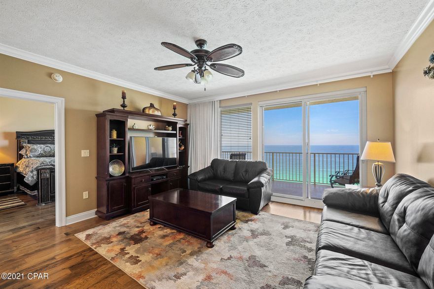 CURRENTLY UNDER CONTRACT, SELLER ACCEPTING BACKUP OFFERSWelcome to your IMMACULATE 2 Bed/2 Bath, with bunk area, Gulf Front Beach Condo! Enjoy stunning views of the Gulf of Mexico from the Gulf Front Primary Bedroom Suite, the main living area and dining area. This Beach Condo is an excellent opportunity for anyone looking for a personal beach retreat or a vacation rental property.  You'll love the custom updates, including the Hickory Wood flooring and tile flooring, crown molding in the main living area, and gorgeous granite countertops in the kitchen. The spacious Gulf Front Primary Bedroom suite, with balcony access, has a huge walk-in closet, and the spacious primary bathroom suite and a walk-in shower with dual shower heads. HUGE laundry room with full size washer and dryer and owner conveys with the condo and the crossovers on the first 4 levels of the parking garage make loading and unloading a breeze. Treasure Island Resort is located on the quiet East End of Panama City Beach which is close to the best restaurants and the World's Most Beautiful Beaches! This unit is pristine, never been rented, and has been very well maintained. Will convey fully furnished, turnkey, and rental ready or for personal use! The pet friendly complex has a large heated pool and a children's' pool and two gazebos, covered parking, four high-speed elevators, fitness room, owner's lounge and game room. This Beach Condo is located on Thomas Drive within walking distance of Saint Andrews State Park and minutes from the area's finest restaurants, fishing, amusement attractions and golf. Treasure Island is well managed with the lowest HOA fees on the beach. Complex is beautiful. Call today to see this beach condo in person!