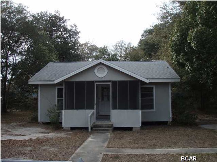 Fully chain link fenced property with double date for driveway, a double cement parking pad and a cement walkway and single gate leading to the cement walkway to the screened-in front porch for foot traffic. Once in the front door, the open floor plan leads thru the living area to the kitchen to the right hand side, straight leads toward the bathroom, while the 2 bedrooms are private to the left side of the home. This home has had improvements and has an effective year built of 1975. The wood frame house needs some repairs, but appears to have had some remodeling, such as, laminate wood flooring.