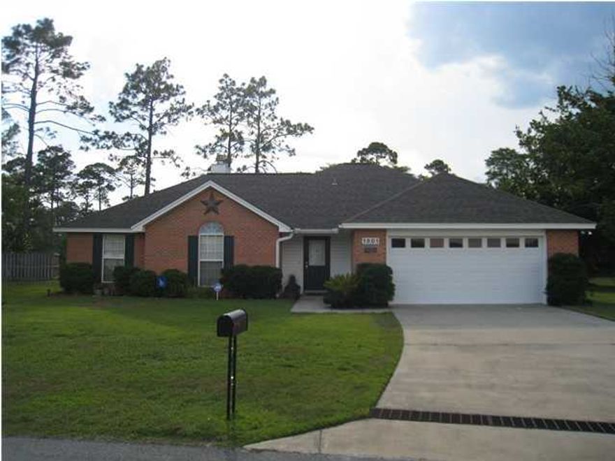 Beautiful well kept Lynn Haven charmer is nestled at the end of a quiet cul de sac with a private backyard. Located in the desirable Britton Woods subdivision, near shopping, restaurants and top schools in Bay County (including award winning Bay Haven Charter Academy serving K-8). About 20 minutes to the beach, Tyndall AFB or the Navy base. You'll be impressed with its ALL brick construction, easy maintenance vinyl trim, and the screened in patio. This home has been well maintained and pride in ownership is evident throughout. The living room boasts a trey ceiling with recessed lighting and a cozy fireplace. The eat-in kitchen offers ample counter and cabinet space with top of the line appliances. The master bedroom is spacious with double trey ceiling and is adjoined by a