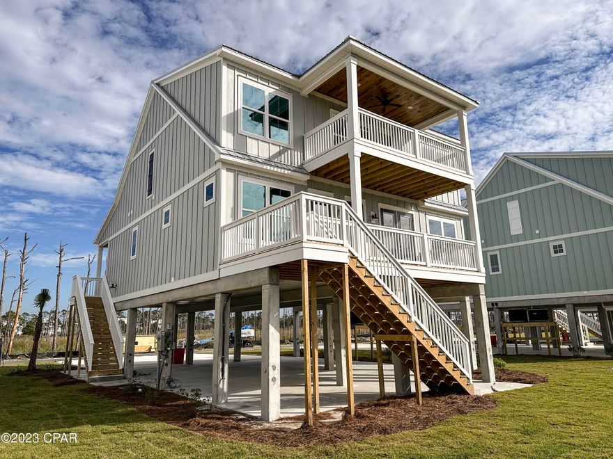 Last available home in Seabreeze at Secluded Dunes on Cape San Blas. Welcome to the exclusive Secluded Dunes community, featuring only 4 new homes on Cape San Blas, Florida. The Ocean floor plan is a luxurious 2 story floorplan that is a perfect fit for the exotic Cape San Blas, Florida. Each home will be built on pilings to highlight the beautiful views of the Gulf of Mexico sunsets. These 2,541 square feet, 4-bedroom, 4-bathroom home will feature 10' high ceilings in the main living areas, bountiful natural light, quartz countertops, and the innovative technology package. As you drive up to these 4 beautiful homes, you will notice how much of a statement these homes make. These 4 homes are adorned with beautiful wood stairs, white painted balconies, and stylish shutters on the windows. This 2-story home is built on pilings that elevate you to the unbeatable views of the Gulf of Mexico, where your sunsets can be enjoyed right on the first or second floor balconies. Inside, you will find luxurious flooring, quartz countertops with undermount sinks, large open floors and bedrooms, and beautiful views of Cape San Blas in each room. The 4 bedrooms and 4 bathrooms come with luxurious finishes and modern flooring. Cape San Blas is known for its natural beauty, relaxed atmosphere, and few tourists. Here you can hike the 1700+ acre state park or tour the 101-foot-tall lighthouse built in the 1800s. You can go kayaking, canoeing, fishing, boating, or walk out onto the beach located within walking distance of these homes. Cape San Blas is a hidden treasure on the Emerald Coast, with beautiful beaches and homes right outside of Port St. Joe, Florida.