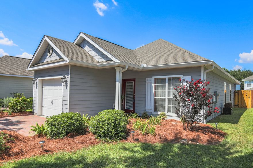 Looking for a lovely, lakefront, quiet neighborhood on the West End of Panama City Beach? Turtle Cove is the one!  This well kept neighborhood boasts tennis courts, community room, exercise room and pool overlooking the beautiful Lake Powell with less than a mile to the beach. This cozy home has tile floors in the living areas, carpet in the bedrooms, crown molding throughout with trey ceilings in both the living room and master bedroom. The kitchen has granite countertops, stainless appliances and a pantry/laundry room. The low maintenance backyard has a shadowbox privacy fence with a rear gate that opens up to an inviting common area maintained by the HOA which is perfect for a stroll. The washer/dryer, separate freezer, refrigerator in the garage, patio table, chairs and umbrella and grill will convey with the sale of the home. All measurements are approximate and should be verified if important.