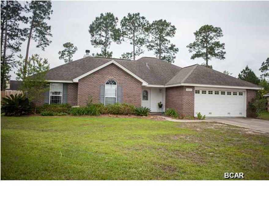AT THE END OF A CUL-DU-SAC, you'll find this all brick home located in Magnolia Meadows. The living room features a wood burning fireplace, tray ceiling and bamboo floors. Adjacent to the living room is the dining room, which has lots of natural light and a tile floor. THe kitchen, which is open to the living room, is well-equipped with a ceramic stove top, pantry, and breakfast bar. The cozy master bedroom is carpeted and features a sitting area. Your buyers will love the double vanity, whirlpool tub, separate shower and water closet in the master bathroom. The 2 additional bedrooms are each unique. One bedroom has a tray ceiling and walk-in closet while the 2nd has a cathedral ceiling. Both are carpeted. The enclosed Florida room is heated and cooled and makes a perfect office