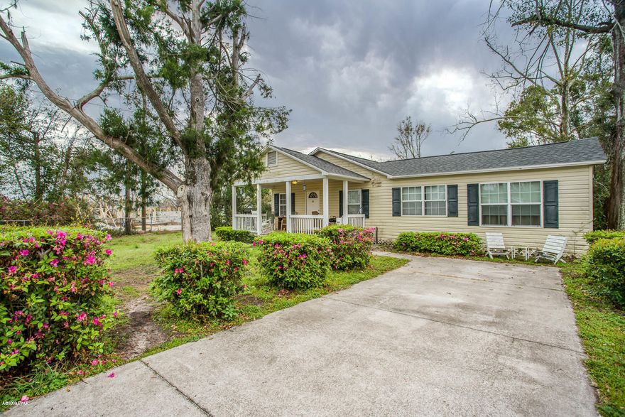 Lovely home situated on a large corner lot with chain link fencing and double gate access. When you pull up to this home you will notice the charming covered front porch. New roof put on August 2018. New A/C system in 2018. Interior features a split bedroom floor plan, spacious living and eat in kitchen area with a breakfast bar. Great opportunity to own this this charming home. All measurements are approximate. Please verify if important.