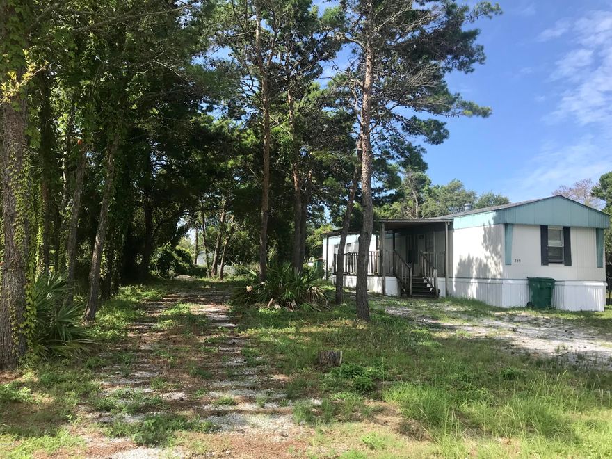 Looking for quiet beach living? This beach property is so convenient to everything; Publix, Winn Dixie,Pier Park, 30A, Lake Powell, and The Gulf. Huge lot to put your boat on too. Affordable living for your primary or secondary residence.