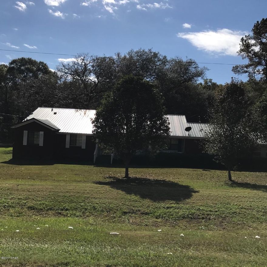 NEW ON MARKET and will not last long!! Large family home just waiting for you!! Located in Campbellton just off Hwy 231. Easy access to Dothan Alabama & Panama City Florida. This home has 3 bedrooms 2 full baths with 2068 sq. ft. under air.  Living room, Dining area and den!  2 Car carport with storage! Home needs some TLC but can be made into the perfect home with conventional financing. All located on 1.75 acres on a paved road!! Call today before this home is Gone…… Sold AS-IS. Home is being offered