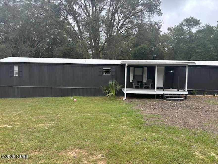 More Photos Coming Soon!!!!     Country Living at its Best!!!!!!!  This property is close to Crestview and Defuniak Springs!  Plenty of room for mini farm, atv riding and gardens on this 4.6 acre fenced property!  This property already has chicken coops and temperature controlled dog kennel!  Also has a shooting range inplace for the hunting ethusiast!  It has county water for the residence and has a  deep well for irrigation too!   This property has a 2 level shop that is wired with AC too!   This property is great for first time buyers or investors that like to subdivide !!!   Call your realtor today for appointment!