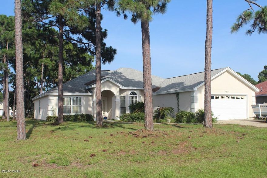 Custom home located in popular Hidden Pines subdivision in Panama City Beach, Florida.  This is a Ledman Homes, built home and is located on a nice corner lot beside a cul-de-sac.  Hidden Pines is just down the street from the Navy Base and only a few minutes to the beach.  The home features an office that could be converted to a 4th bedroom, high ceilings, open floor plan, 2 car garage and split floor plan.  This home is priced well below market due to it is in need of new flooring, appliances along with minor cosmetic repairs and paint.  With a little TLC, this will be a lovely home just down the road from The World's Most Beautiful Beaches.  This home will not go FHA or VA financing.  Home is priced according to repairs needed.  Sellers are firm on price and looking for a cash offer.