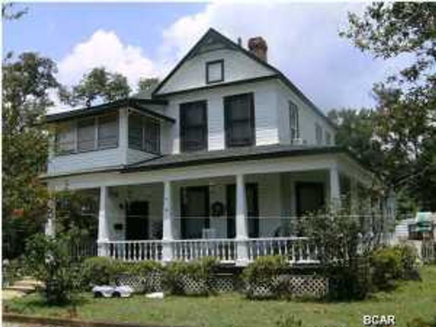 PRICED BELOW CURRENT APPRAISAL-Landmark bay view historic district home built by George Marshall at peak of Apalachicola lumber boom in 1907. Foyer and staircase highlight local craftsmanship, style and design. High ceilings, crown molding, four fireplaces, built-in cabinets and bookcase, oak and heart pine floors, open porches, widow's walk, all on large corner property with outbuildings. New roof in 2008.