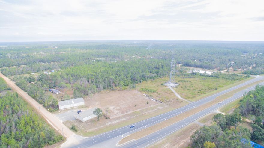 This is a prime commercial property with 2 large warehouses that sit RIGHT ON Hwy 231.  The lot is 11.166 acres!  The warehouse that sits directly on Hwy 231 is 3200 sqft, has 2 large roll up doors and a spacious office and security system already in place.  The second warehouse is 5000 sqft with 3 large roll up doors.  Both warehouses sit right next to one another so you have plenty of land to keep your materials or equipment for your business.  This won't last long!