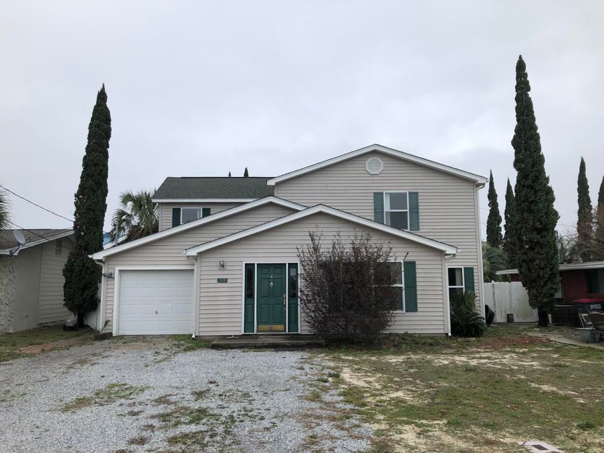 Nice 3 bedroom home within walking distance to the beach with an inground pool.  The floor plan features large open rooms and oversized master bedroom.  The first floor offers living room, dining room, kitchen, family room, breakfast area and full bathroom that leads out to the pool.  Upstairs is the master bedroom, two additional large bedrooms and oversized bathroom.  The fenced in back yard has large open patio and inground pool.  This home is close to Pier Park, shopping, dining and the Worlds Most Beautiful Beach.  Call before its gone!!!