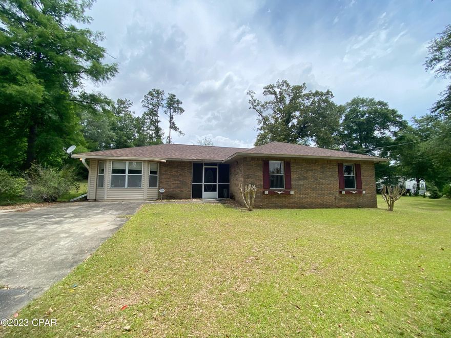 Nice brick home in a quiet neighborhood.  This house features 3 bedrooms, 2 full bathrooms, kitchen/dining combination open to a living room with a wood burning fireplace and a second living space which could be used as an office, family room or formal dining.  There is also a large screened back porch for outdoor living and 2 outside storage sheds, one with water and electricity and a lean-to that makes a great workshop or added storage space. You'll love this generous sized yard with established oaks and surrounded by trees on 2 sides. Roof was replaced in 2019; HVAC approx. 16 years old. Kitchen appliances & washer & dryer included.