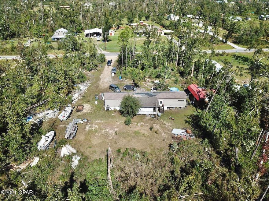 Check out this amazing property, over 5 acres of land and just a short drive to town, Tyndall Air Force Base, Shopping, Dining, Beautiful downtown Panama City. Located just off Hwy 231 you are minutes away from the world's most beautiful beaches. The property currently has a power, well, septic tank with a mobile home that can be rebuilt to live in or rent out, removed and replaced, or build your forever home! There are endless possibilities with this large piece of property!