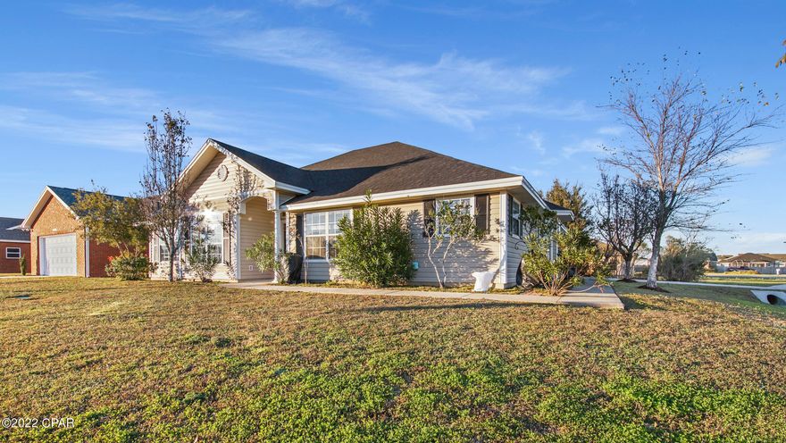 CURRENTLY UNDER CONTRACT, SELLER WILL CONSIDER BACKUP OFFERS Welcome to your new home! Located on a large corner lot in the Cherokee Heights neighborhood, this home offers a spacious open floor plan with plenty of room in the living room to host all of your friends and family. The renovated kitchen boasts new cabinetry, tile backsplash and quartz countertops with two windows letting in lots of sunshine and light. The master bedroom is oversized with an en suite bathroom featuring a beautiful tiled shower, separate bathtub and double vanity. The additional bedrooms are roomy and one can easily be used as an office or flex space. The covered back patio is perfect for grilling out and entertaining and overlooks a private, fenced, well maintained backyard. Close to Tyndall and shopping all i