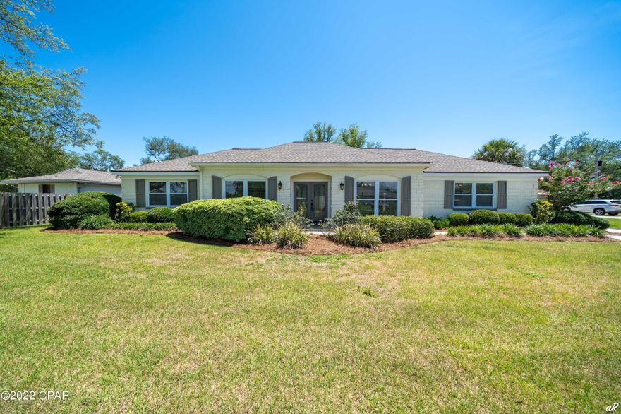 CURRENTLY UNDER CONTRACT, SELLER ACCEPTING BACKUP OFFERS! Boaters paradise! This home has a 12,000 lb boat lift, boathouse, and dock. The  deep water canal gives you quick access to the Gulf.  Enjoy a trip to shell island or go fishing for the day!  This meticulously maintained brick home is conveniently located to historic St. Andrews offering a short car ride to local restaurants and shops. Home has updated kitchen appliances, large closets and laundry room offering plenty of storage, split floor plan, roof replaced in 2018, and the list goes on! The oversized driveway allows plenty of room for all your toys. Call your favorite realtor today! Buyer to verify measurements if important.