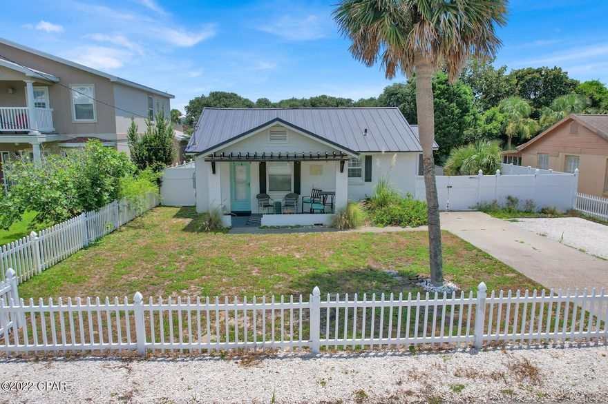 Florida cottage in Bid-A-Wee with deeded beach access! Just one short block to the sandy white beaches. This two bedroom/one bath home is updated and completely furnished. It is turn key ready for a vacation rental. New AC/Heat was installed in 2017. Some other updates include paying to reline all plumbing, newly installed backyard fence, fresh interior and exterior paint, extended the parking area, new metal roof, as well as other interior updates. This is a must see! Make your appointment today. All measurements are approximate, please verify.