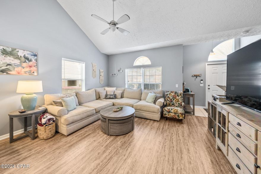 CURRENTLY UNDER CONTRACT, SELLER ACCEPTING BACK UP OFFERS. Location is key! Welcome to Palm Cove on Panama City Beach where you'll enjoy this 3 Bed, 2.5 Bath townhome located less than 1 mile from the sandy white beaches, great restaurants, shopping and entertainment for the entire family.  

This community is gated and offers 2 community pools, a playground and incredible green space. Palm Cove also allows for short term rentals. Similar townhomes in the community have produced over $55,000 in annual rental income making this a solid investment for short term rentals. 

As you step through the front door, you're greeted with vaulted ceilings and a great room flooded with natural light. This spacious area offers a dining room between the kitchen and living area and a convenient powder room for guests on the main level. The kitchen offers a galley style and is open to the dining room with ample countertop space. A favorite feature of this home is the large walk-in pantry just off the kitchen! 

The primary suite is on the main level of this townhome and also offers access to your own private patio. Enjoy the green space behind the townhome or for additional privacy, an HOA approved fence may be installed. The primary bath features a shower and tub combination with a large closet. 

Just up the stairs, you'll find 2 guest bedrooms and a shared guest bath. These two guest bedrooms are large and spacious with ample closet space. For those who desire to work from home or want flex space for a fitness room/craft room - these room are perfect for your flexibility! 

Live your best life at the beach in the center of town! Walk to breakfast or coffee each morning, enjoy bowling and an arcade around the corner or take a stroll to watch the best sunsets that Florida has to offer each evening. THIS is the location and at only $295,000, this is the perfect opportunity to own an affordable townhome on the beach. Ideal for a full-time residence or make it your own lucrative short term rental investment property!