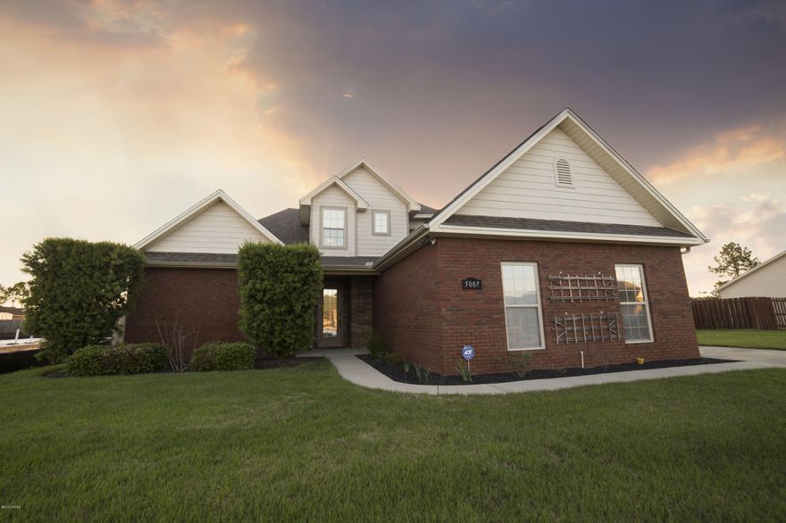 This beautiful brick home is move in ready! Bright entry opens into the living room with 1/2'' carbonized bamboo hardwood floors, gas fireplace with granite inlay, dining area open to living room and kitchen, and tinted windows throughout. Kitchen features granite countertops, gas stove/oven, and raised panel cabinets. 1/2 bath for guests off of the entry. Master bedroom is located on the 1st floor with hardwood floors and a trey ceiling. Master bath features  a double vanity, jacuzzi tub, separate shower, wake in closet, and tile floors. The 2nd floor consists of 2 nice sized bedrooms and a full bath. Fresh paint thought, sealed garage flooring with Epoxy, LARGE backyard, cedar fencing, Zoiza sod, eco flush toilets, 12 yr rubber mulch in flower beds, and french drain with down spout pipin
